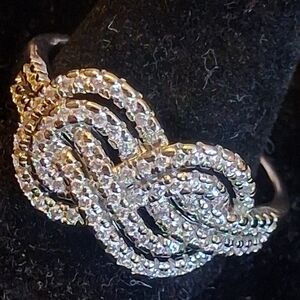 Elegant Silvertone Knot Ring Encrusted With Round Faux Diamonds 11 3/4